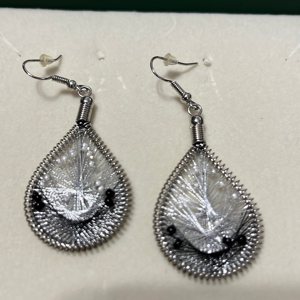 Silver and black decorative hoop earrings